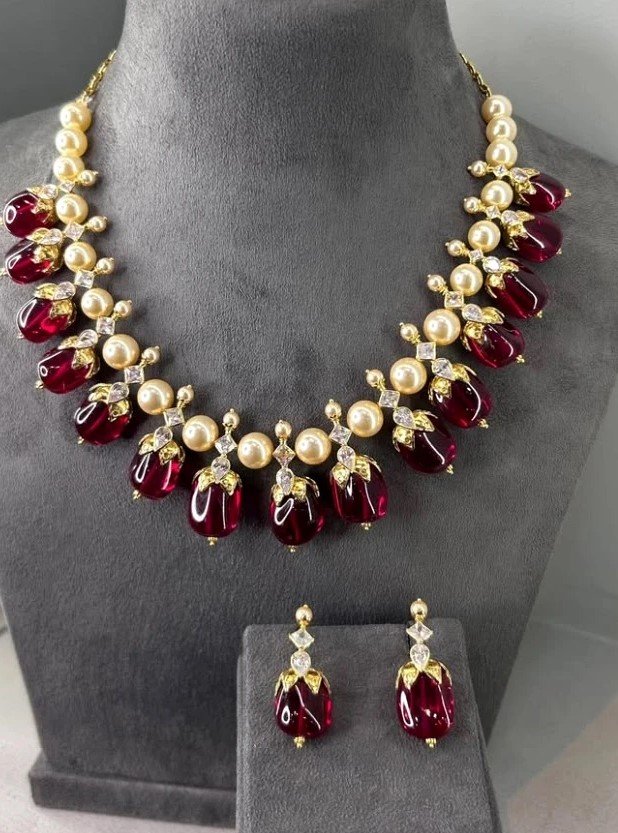 Ruby-tone drop necklace and matching earrings with pearl accents